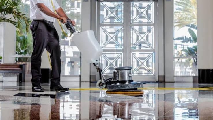 Commercial floor cleaning with a floor buffer in a Northern Virginia building