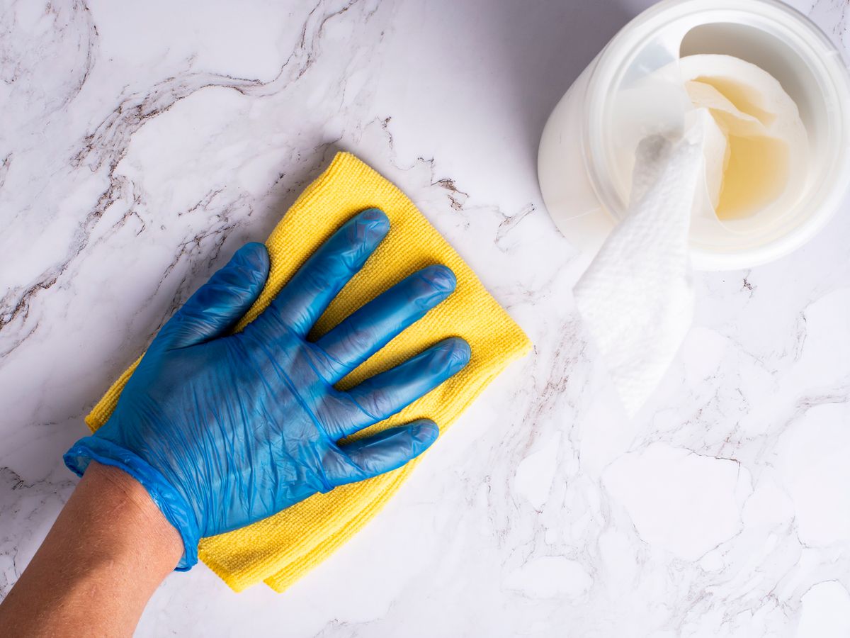 Technician disinfecting high-touch surfaces in a Maryland facility